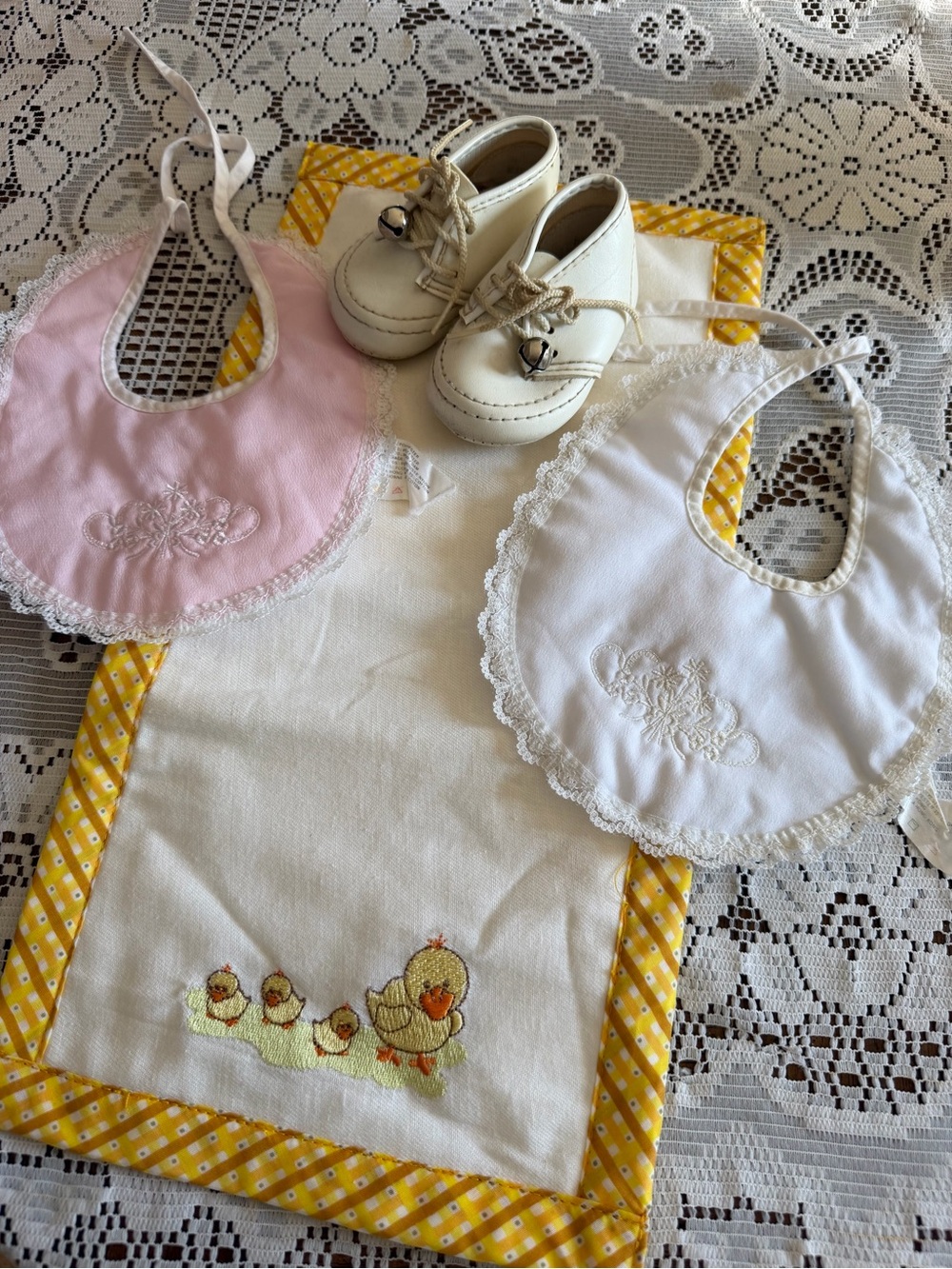 Vintage Baby Bib Set with Pink and White Lace-Trimmed Bibs and Cream Baby Shoes